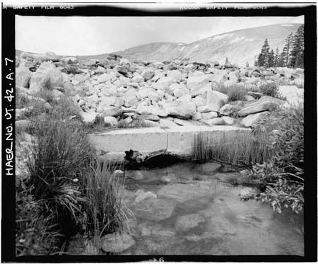 HAER photo of downstream outlet pipe collar, looking southwest, July 1984