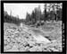 HAER photo of downstream face and dam and outlet channel, looking east, July 1985