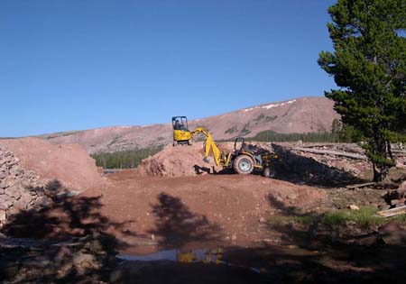 13-Clements Lake Stabilization, initial excavation through the dam, tractor and mini-excavator are used for excavation