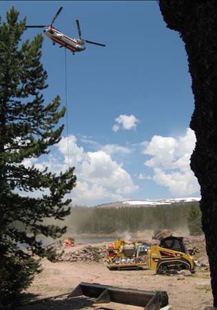 01b-East Timothy Stabilization, helicopter delivers materials to site