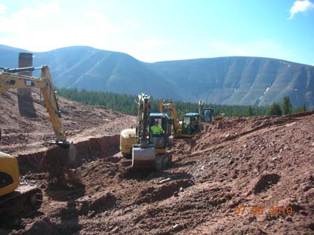 08-East Timothy Stabilization, all four trackhoes working in breach before placing cut-off walls and riprap