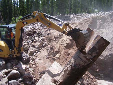 09-Island Lake Stabilization, removing outlet structure and pipe prior to grouting