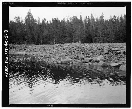 HAER photo of upstream face of Island Lake Dam, showing outlet gate, July 1985