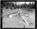 HAER photo of outlet gate wheel and stem with outlet channel in background at Island Lake Dam, July 1985