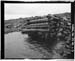 HAER photo of cribbed log housing for outlet gate wheel at Superior Lake Dam, July 1985