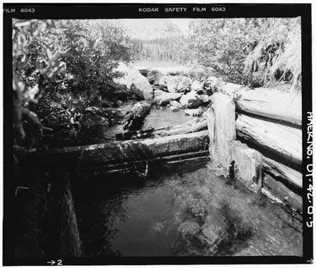 HAER photo of wood outlet weir at White Miller Lake, looking north, July 1985